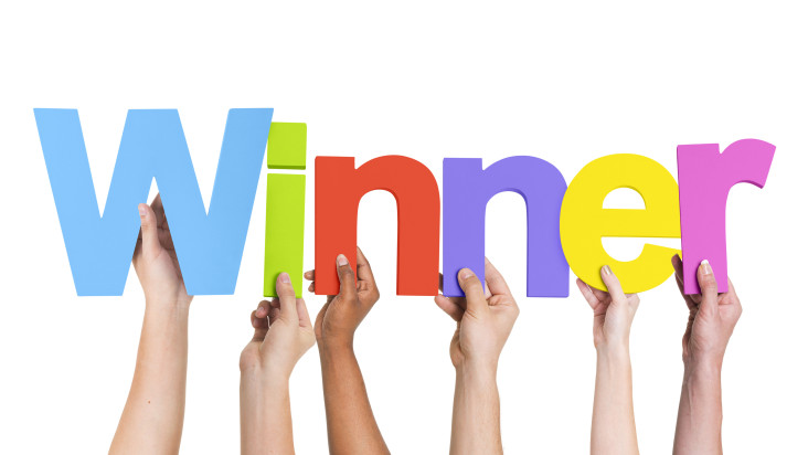 Multiethnic Group of Hands Holding Winner